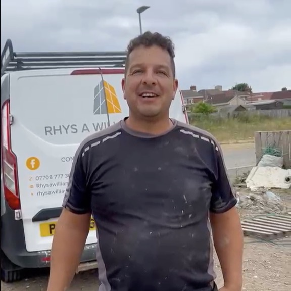 Rhys from Rhys A Williams Ltd on site next to his company van