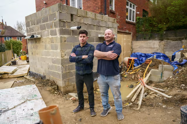 Graham Nash with a homeowner at a property in Leeds, as featured in the Yorkshire Evening Post